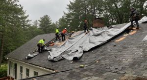 Emergency roof patching after storm damage in Weston, Massachusetts